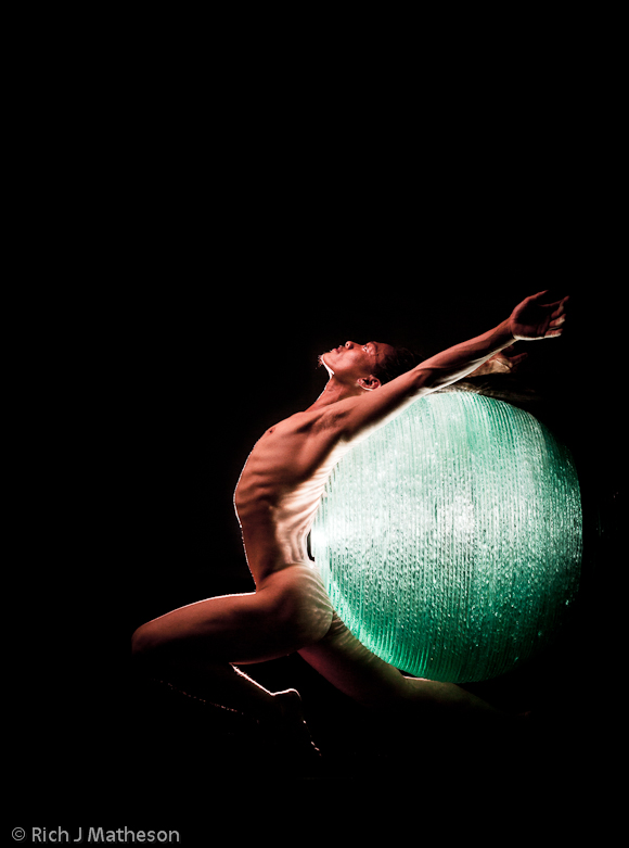 Dancer Billy Chang with colored glass art ball