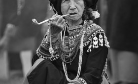 Bunun Aboriginal Woman Smokes a Pipe at Ear Festival in Namasia